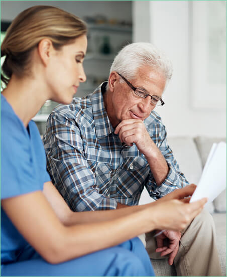 psychiatrist and patient looking at papers