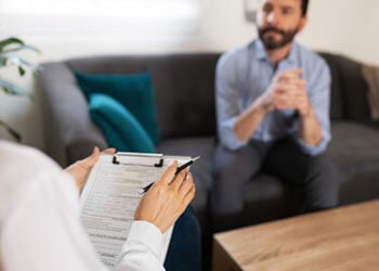 psychiatrist talking to patient 