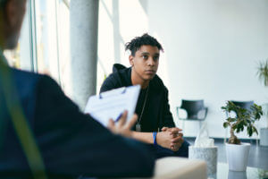 teenager having psychotherapy session at psychologist's office